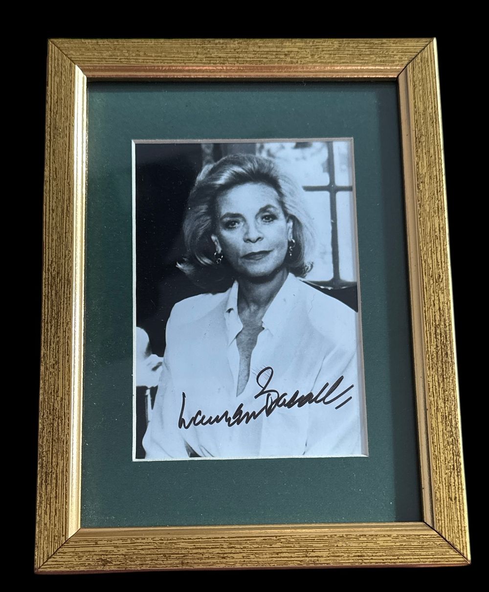 Lot 189: Lauren Bacall signed black and white photo. mounted...
