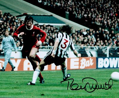 Tommy Smith signed 10x8inch colour photo pictured in action for Liverpool. Good condition. All 