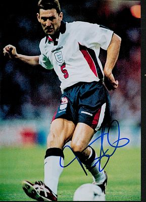 Tony Adams signed 10x7inch colour photo pictured in action for England. Good condition. All 