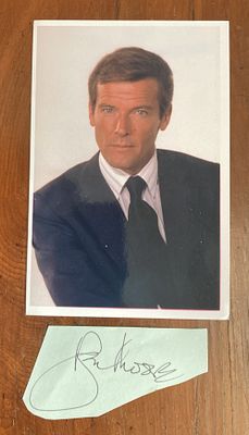 James Bond Roger Moore signature piece with 6 x 4 inch colour photo. Irregular cut large autograph.