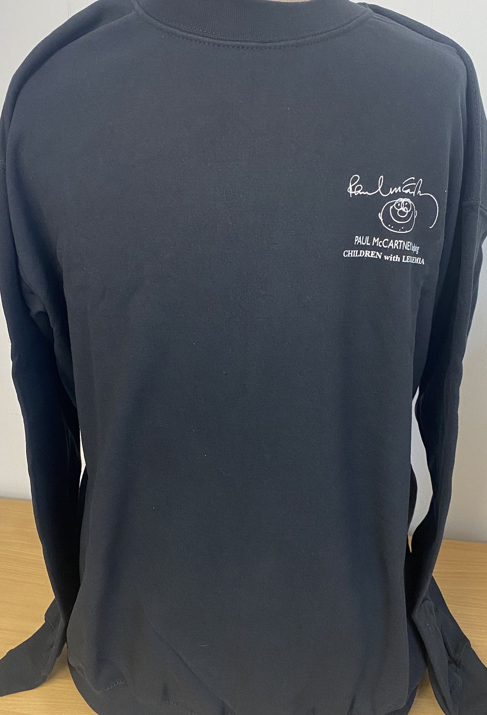 Lot 222: Paul McCartney helping children leukaemia charity jumper, unsigned,...