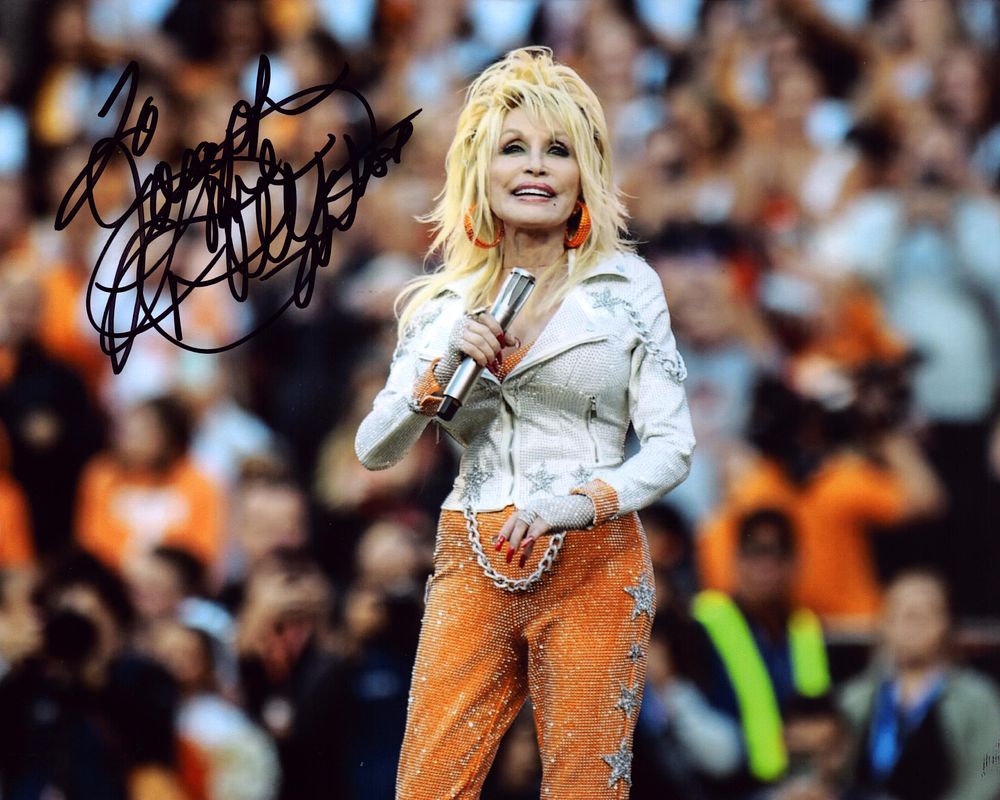 Lot 246: Dolly Parton signed 10inch colour photo.