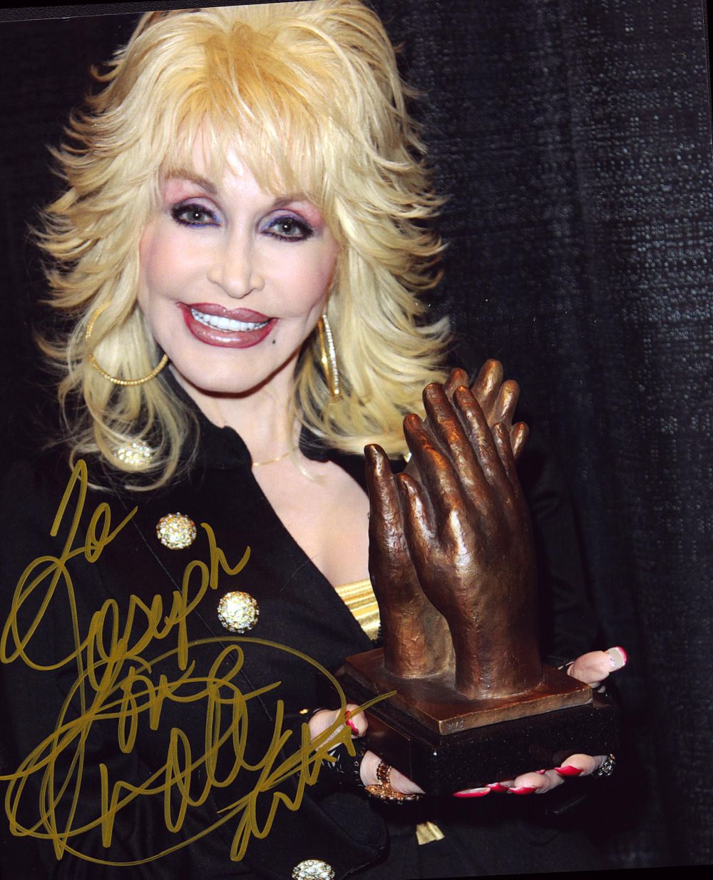 Lot 247: Dolly Parton signed 10inch colour photo.