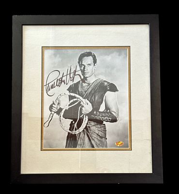 Charlton Heston signed black and white photo from the movie Ben-Hur. Mounted and framed 