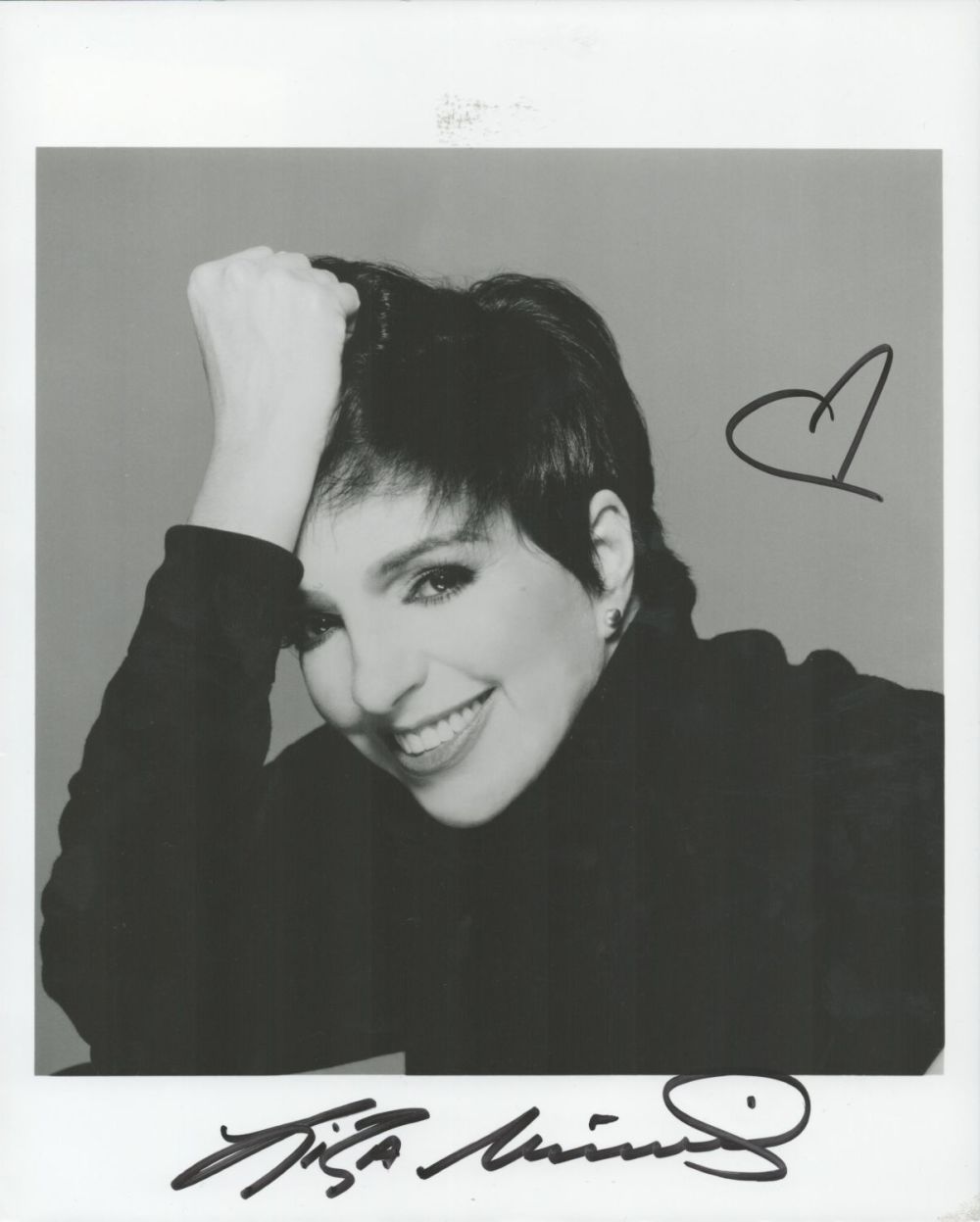 Lot 240: Liza Minnelli signed 10x8 black and white photo....