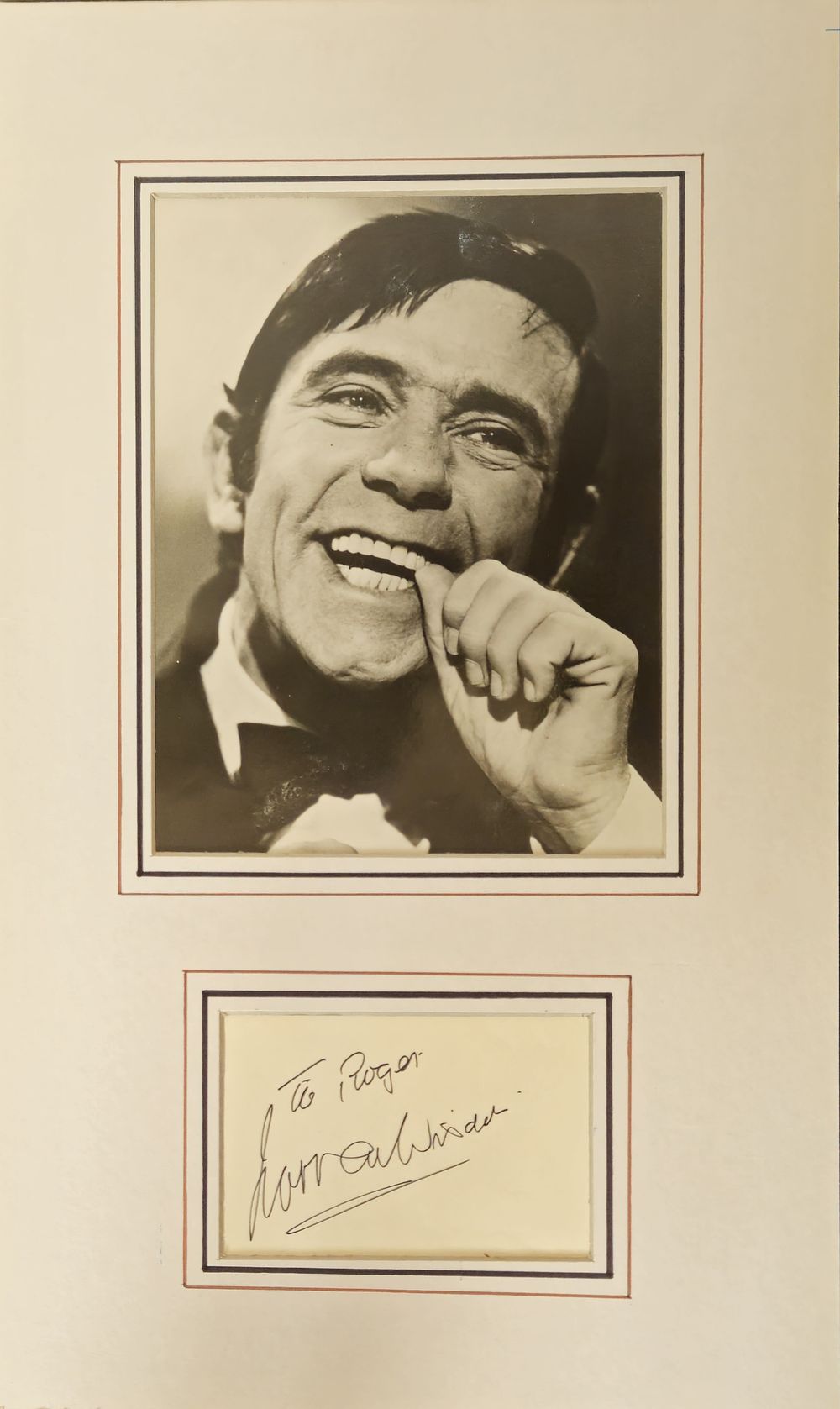 Lot 482: Norman Wisdom signature piece mounted below black and...