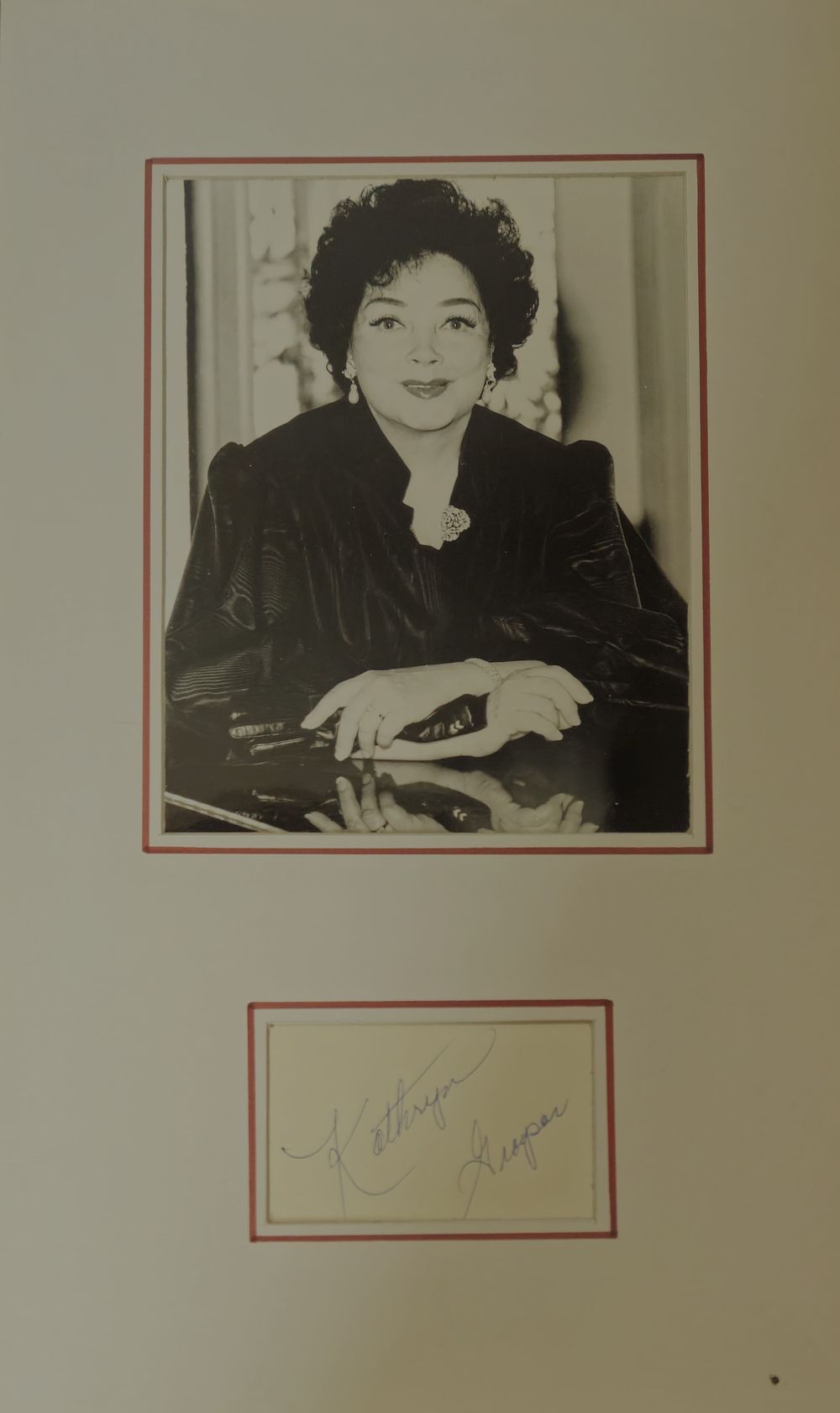 Lot 489: Kathryn Grayson signature piece mounted below black and...