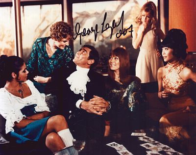 George Lazenby signed coloured James Bond 10x8inch photo.