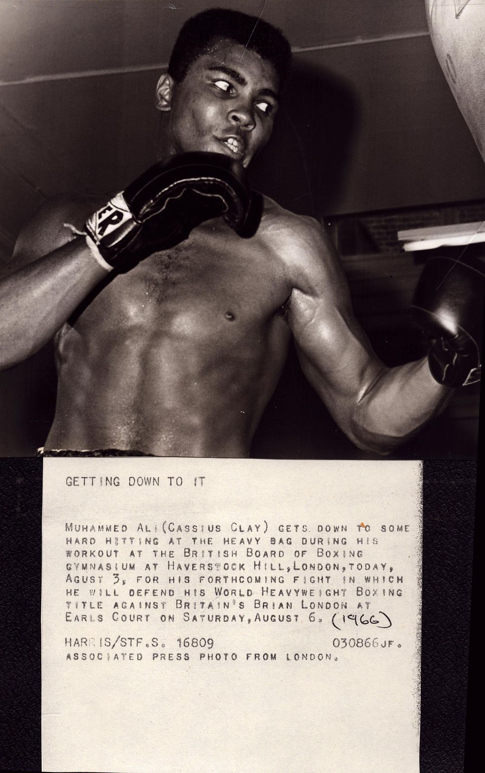 Lot 299: Muhammed Ali black and white photo getting down...