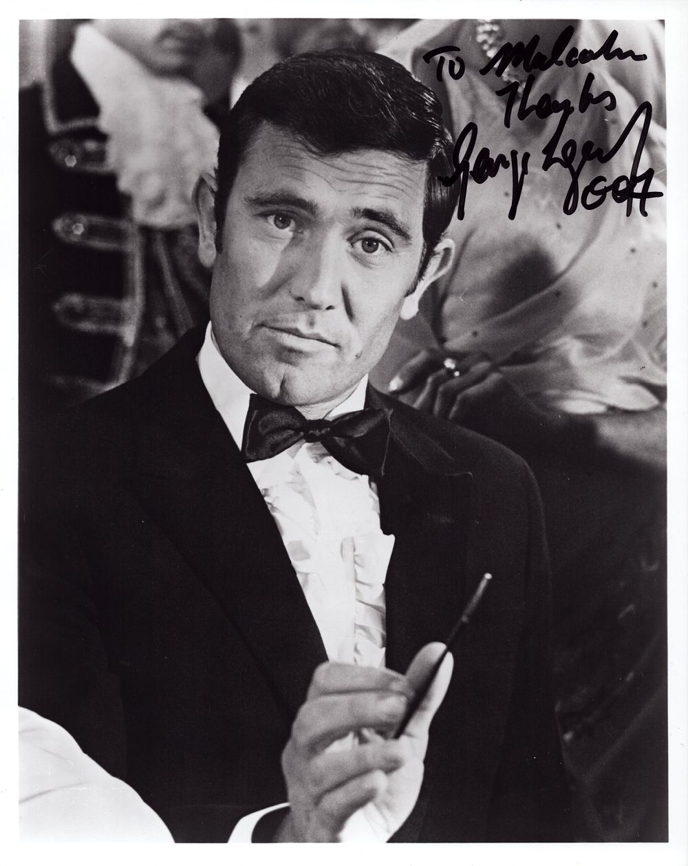 Lot 566: George Lazenby signed 10x8inch black and white James...