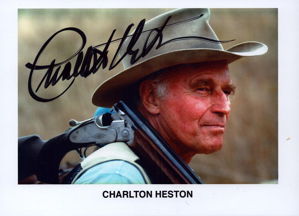 Lot 576: Charlton Heston signed 7x5inch colour photo.