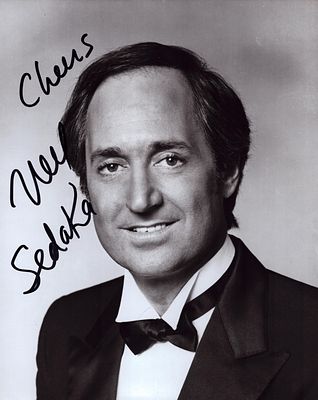 Neil Sedaka signed 10x8inch black and white photo.