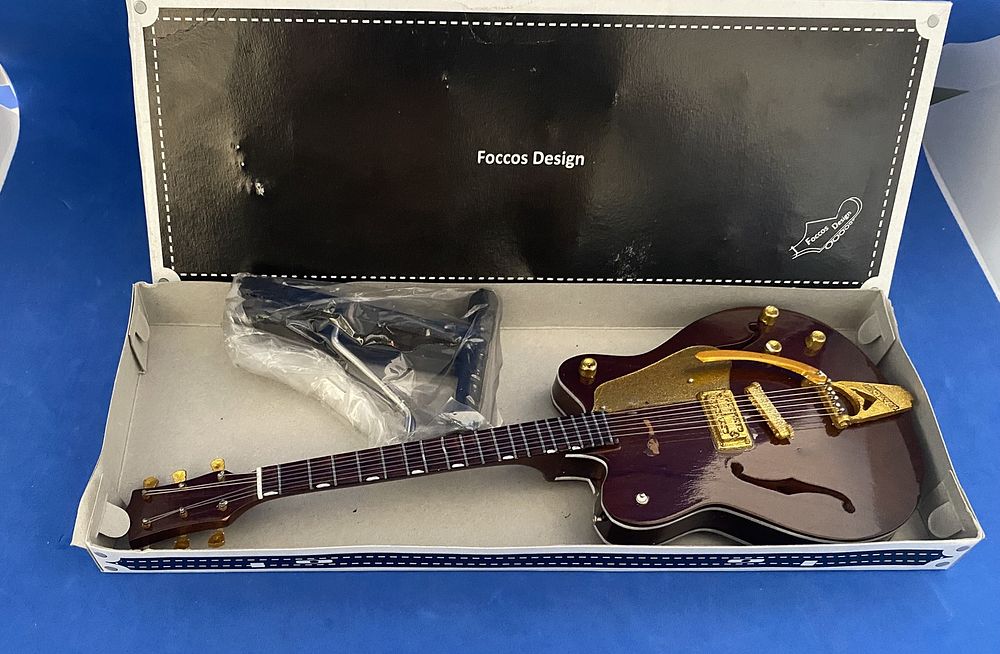 Lot 402: George Harrisson- Beatles #Gretsch Style, miniature model guitar,...