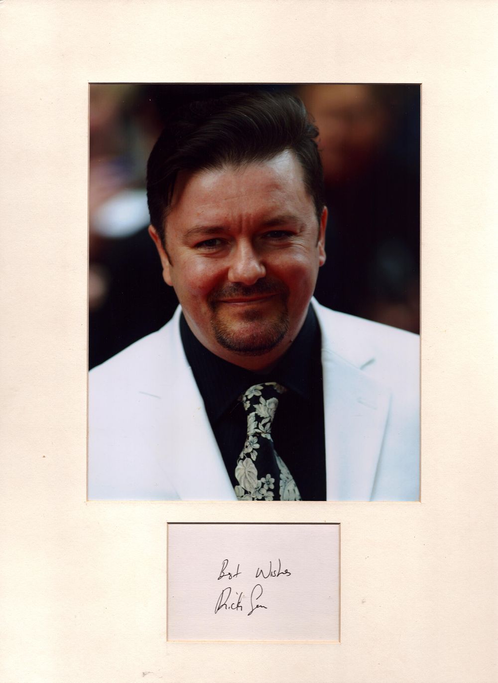 Lot 513: Ricky Gervais signature piece with colour photo. Mounted....