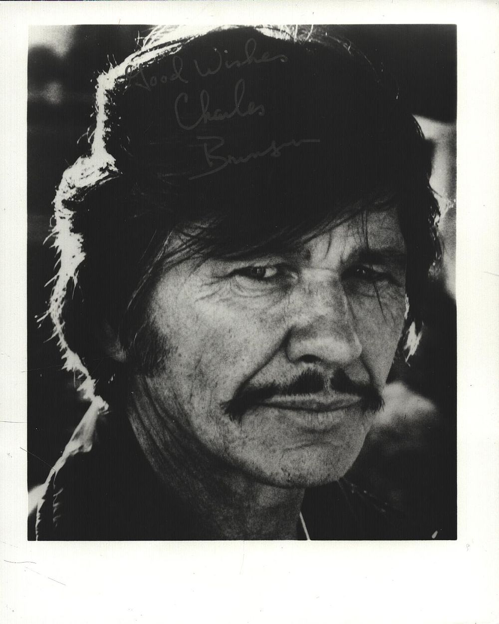 Lot 355: Charles Bronson signed 5x4inch black and white photo.