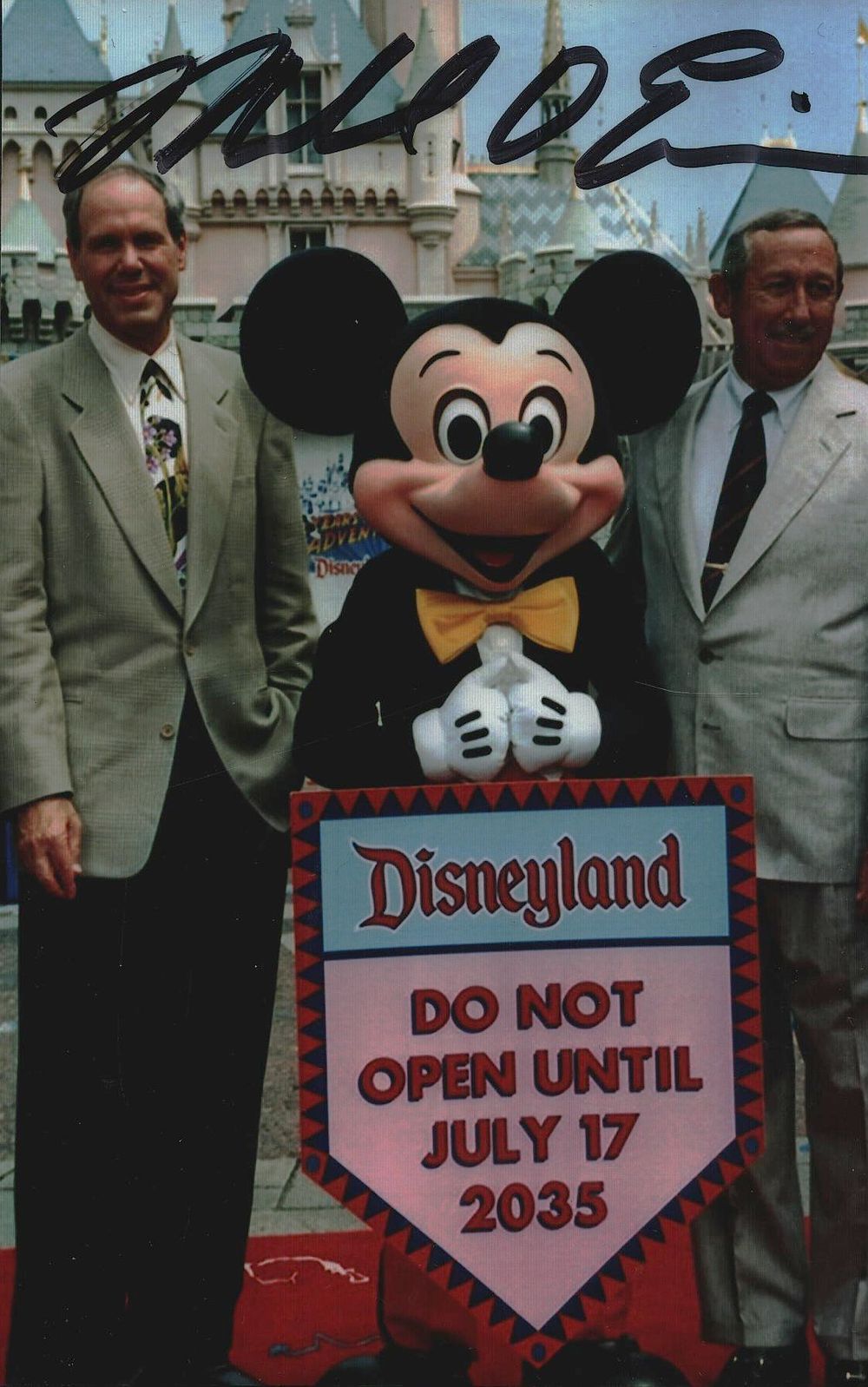 Lot 277: MICHAEL EISNER Disney CEO signed Disneyland Photo .