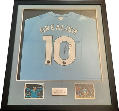 Lot 528: Jack Grealish signed replica Manchester City. Framed and...