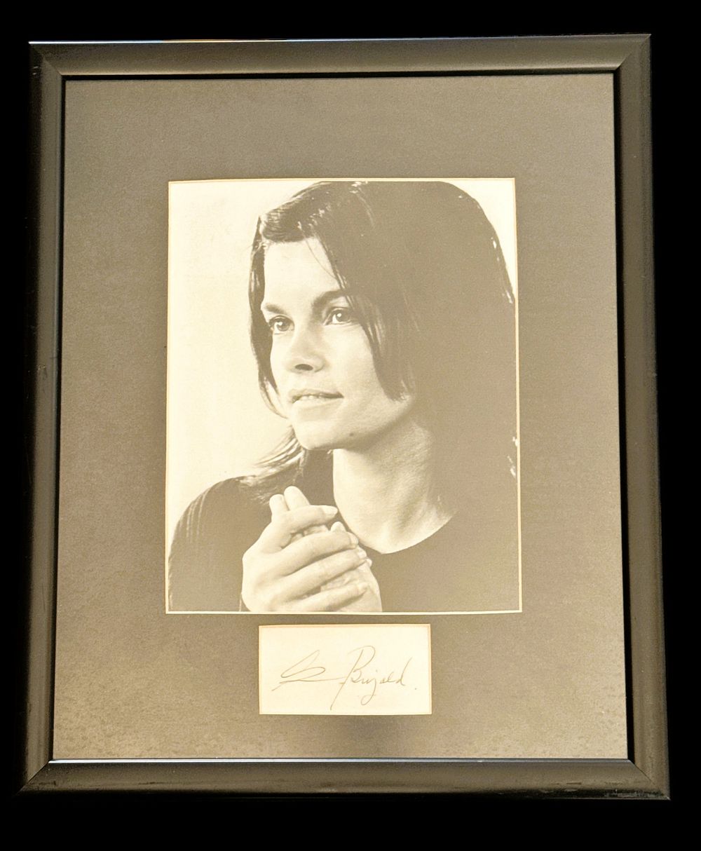 Lot 547: Geneviève Bujold signed black and white photo. Mounted...