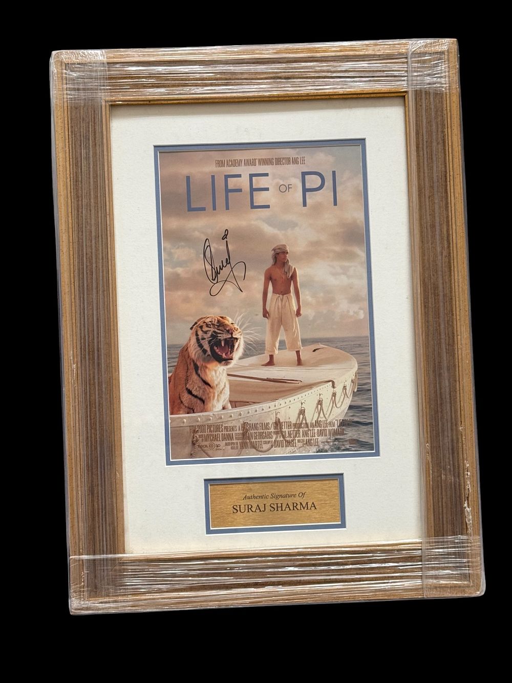 Lot 567: Suraj Sharma signed 21x15 inch mounted and framed...