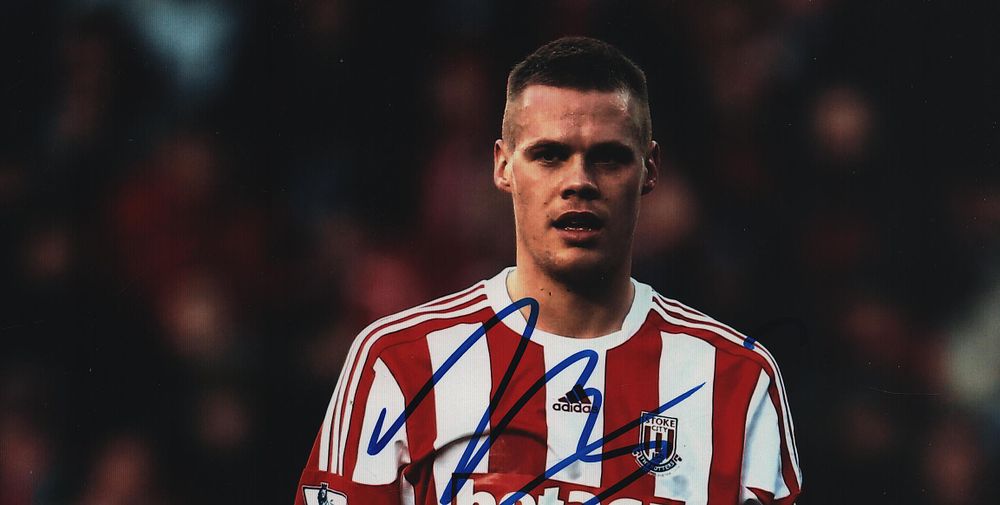 Lot 276: Ryan Shawcross signed 8x4inch Stoke City colour photo.