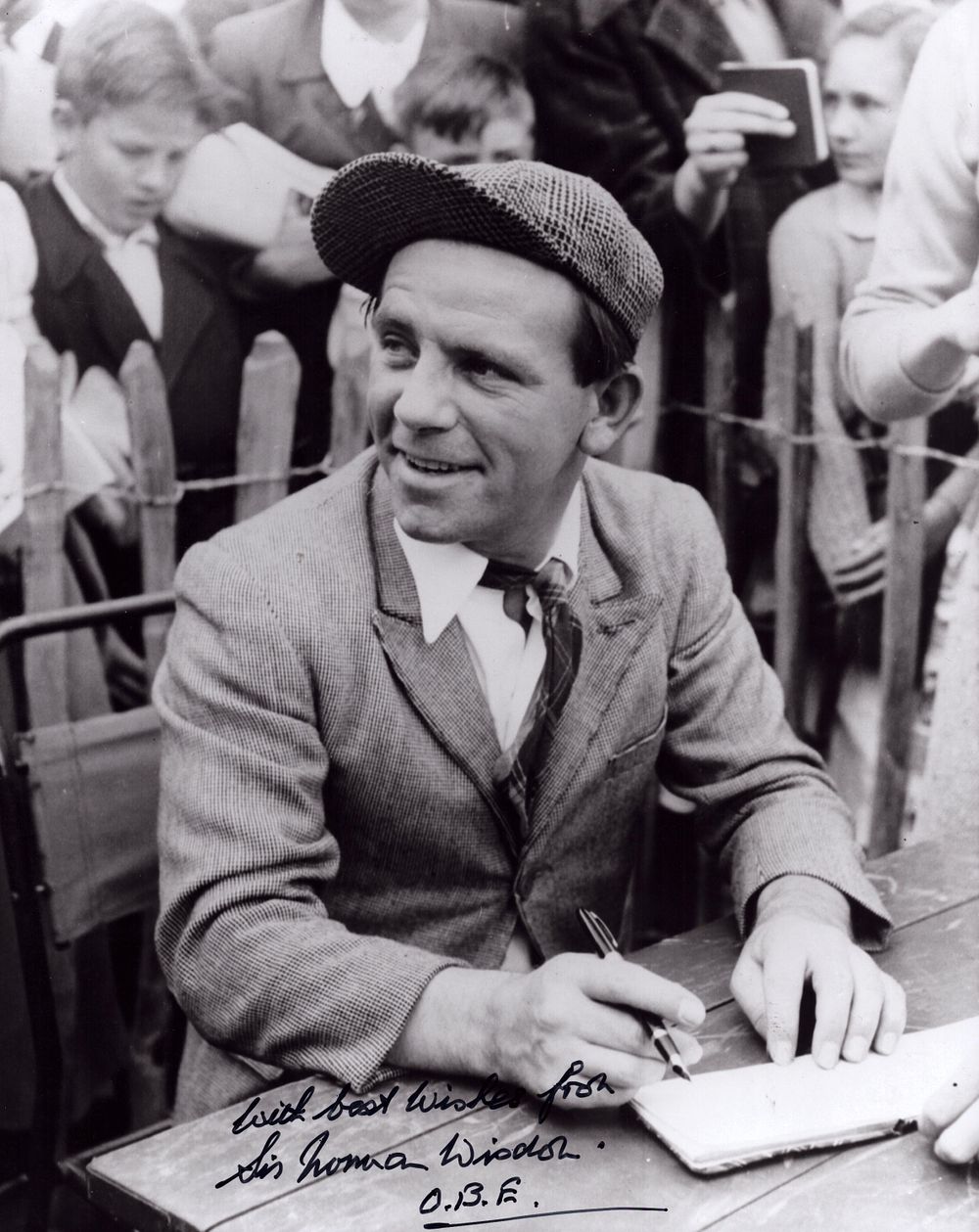 Lot 156: Norman Wisdom signed 10x8inch black and white photo.