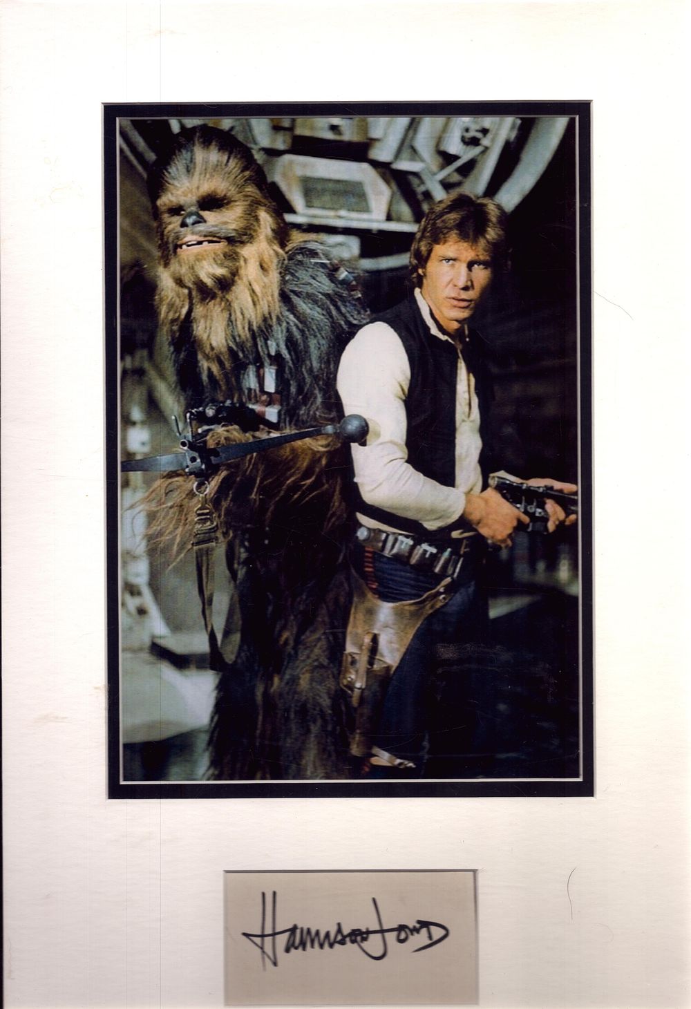 Lot 355: Harrison Ford signed mounted picture with signature piece...