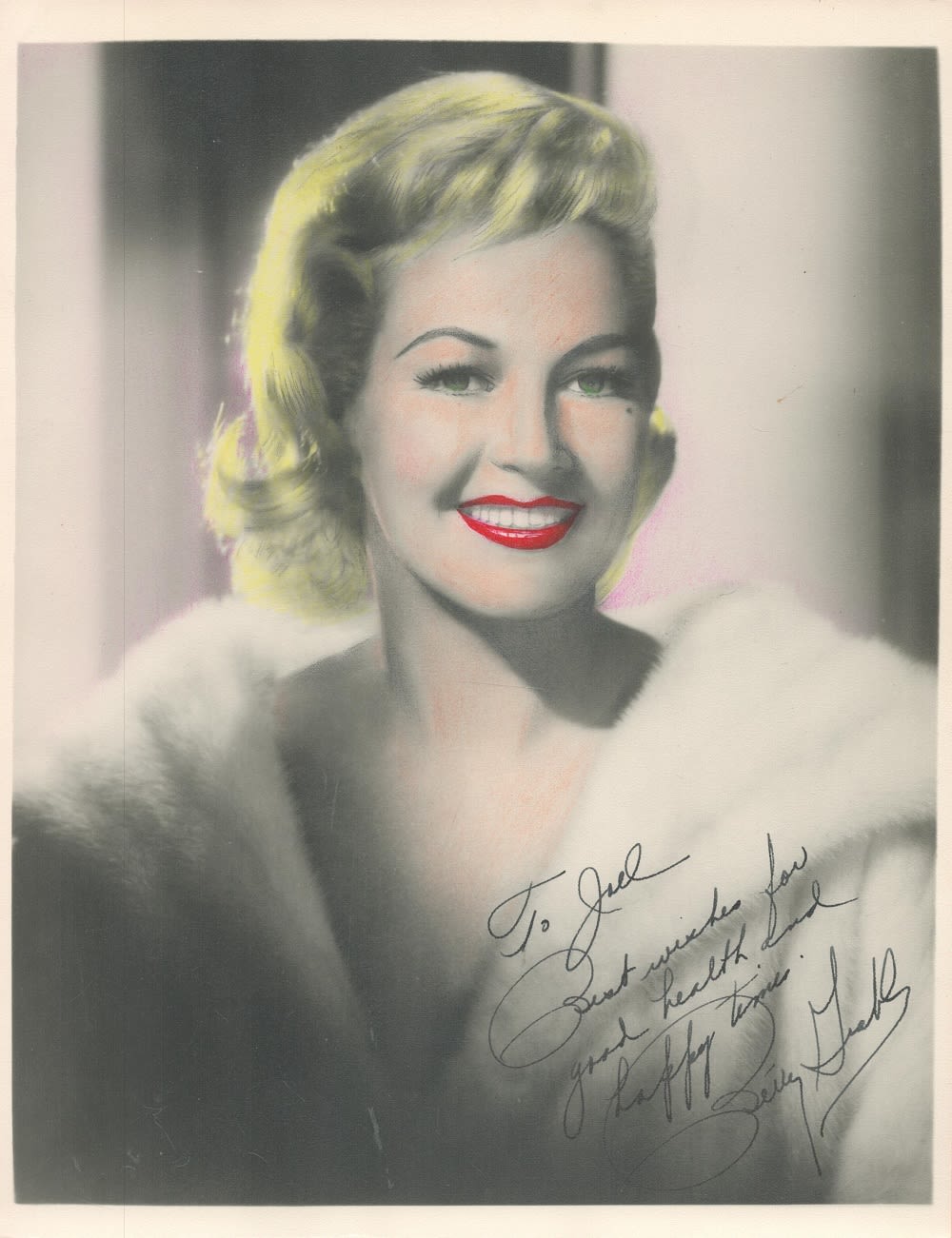 Lot 307: Betty Grable signed 10x8 colourised vintage photo. Dedicated,...