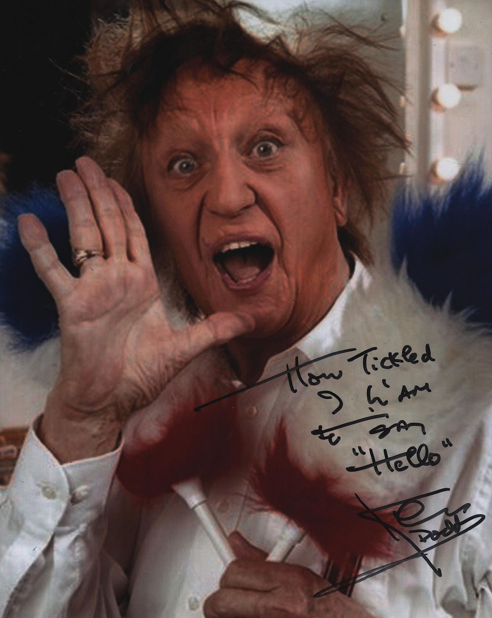 Ken Dodd signed 10 by 8-inch colour photo.