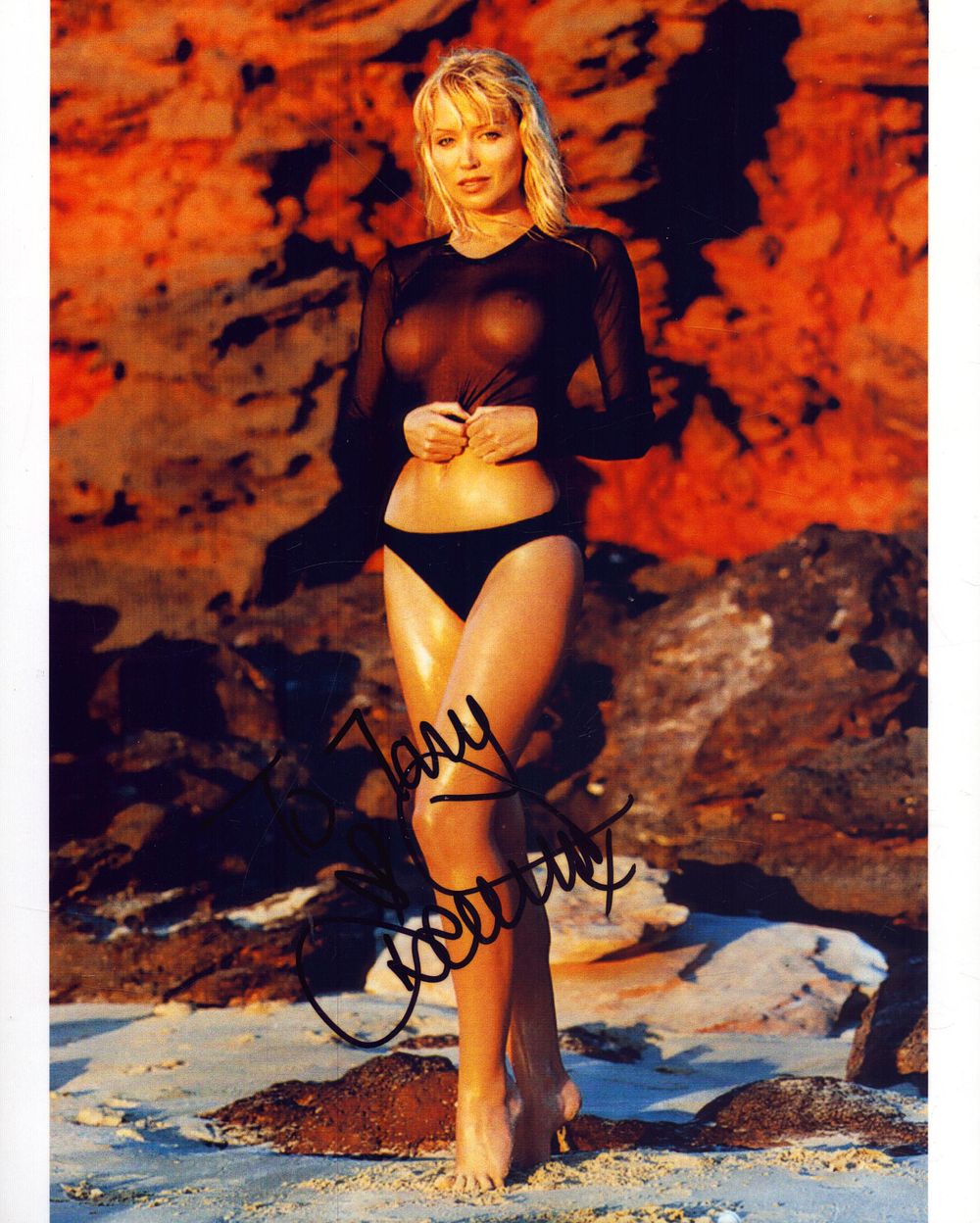 Lot 319: Dannii Minogue signed 10X8 inch colour risqué photo.