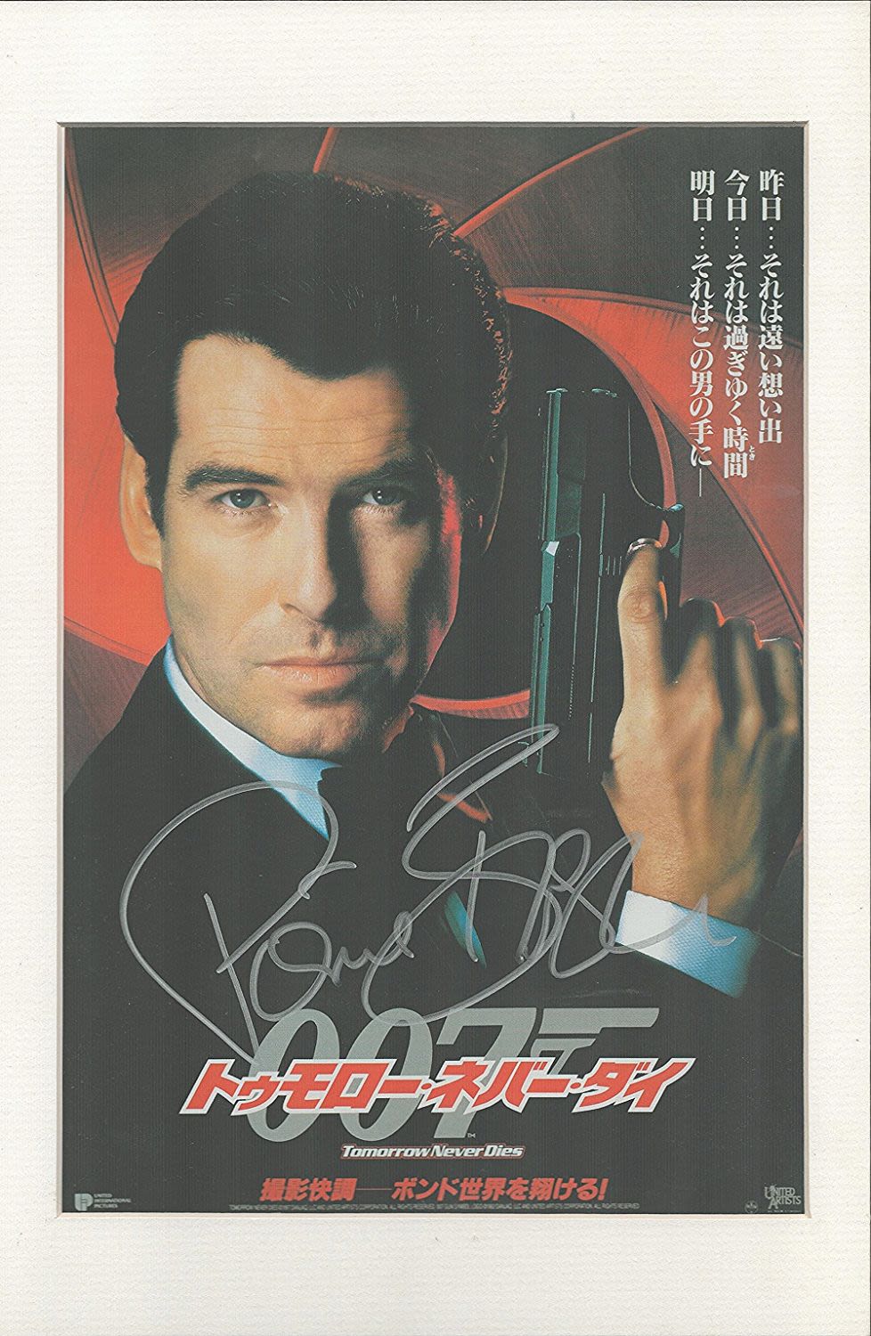 Lot 565: Tomorrow Never Dies signed mounted colour promo photograph....