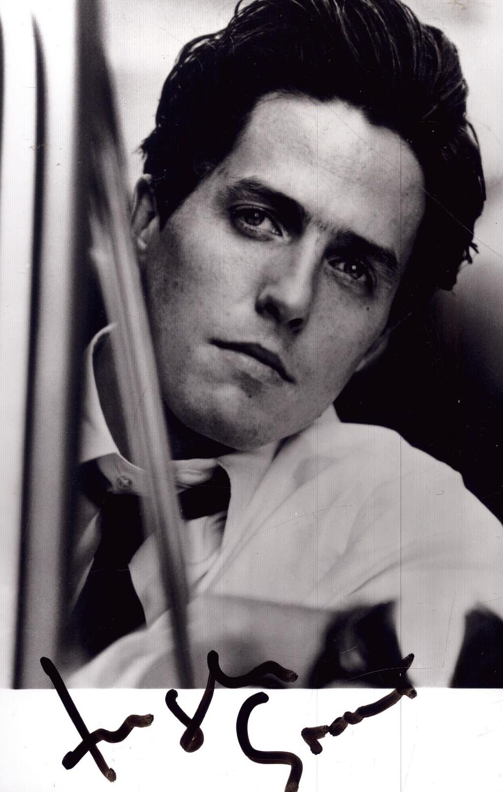 Hugh Grant Signed 6X4 inch black and white photo.