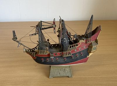 Jolly Roger ship model, some of the front masts have dethatched and are loose.