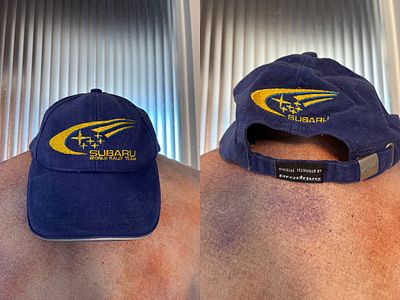 Subaru World Rally Team blue cap.
