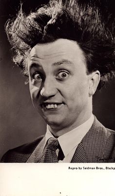 Ken Dodd signed six by 4 inch black and white photo signed on the reverse
