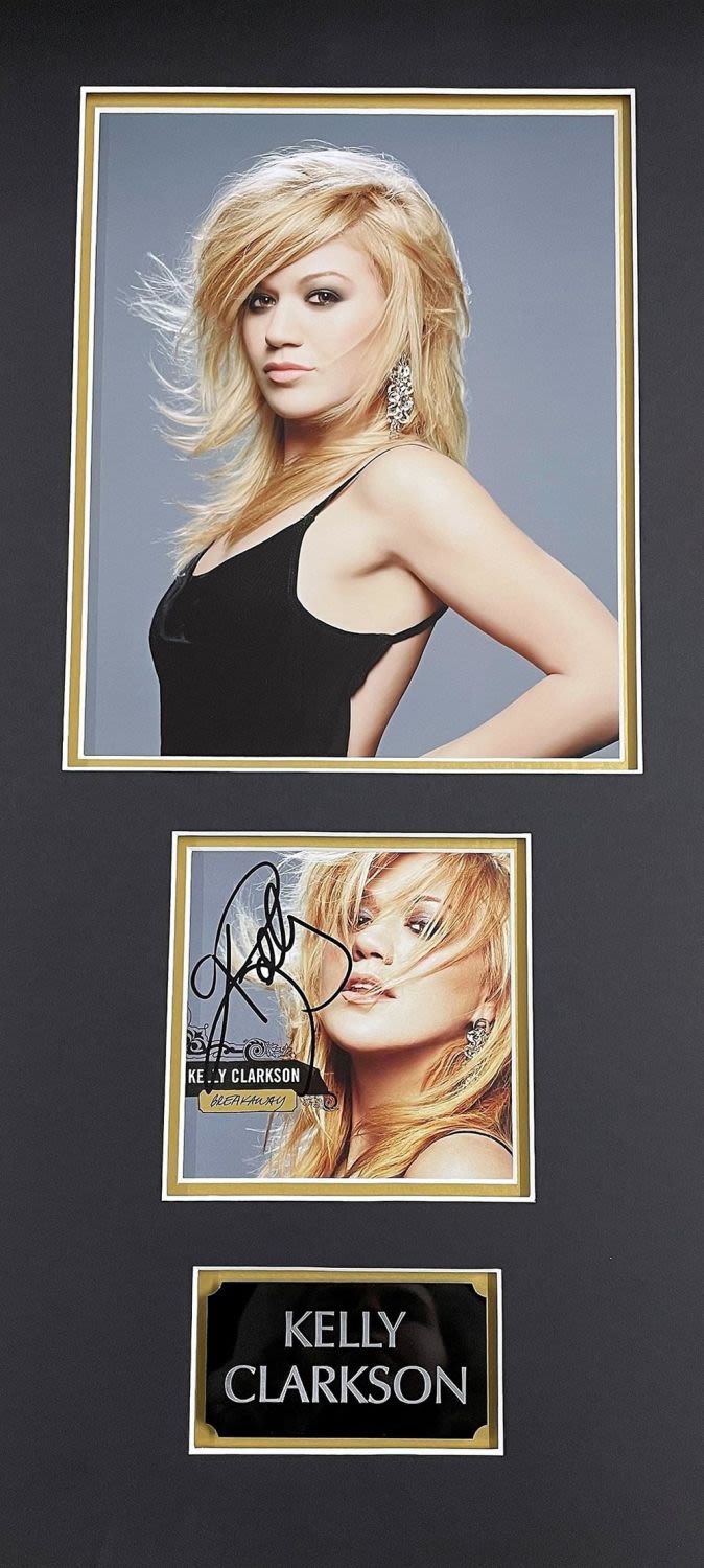 Lot 83: Kelly Clarkson 22x11 overall mounted signature display includes...