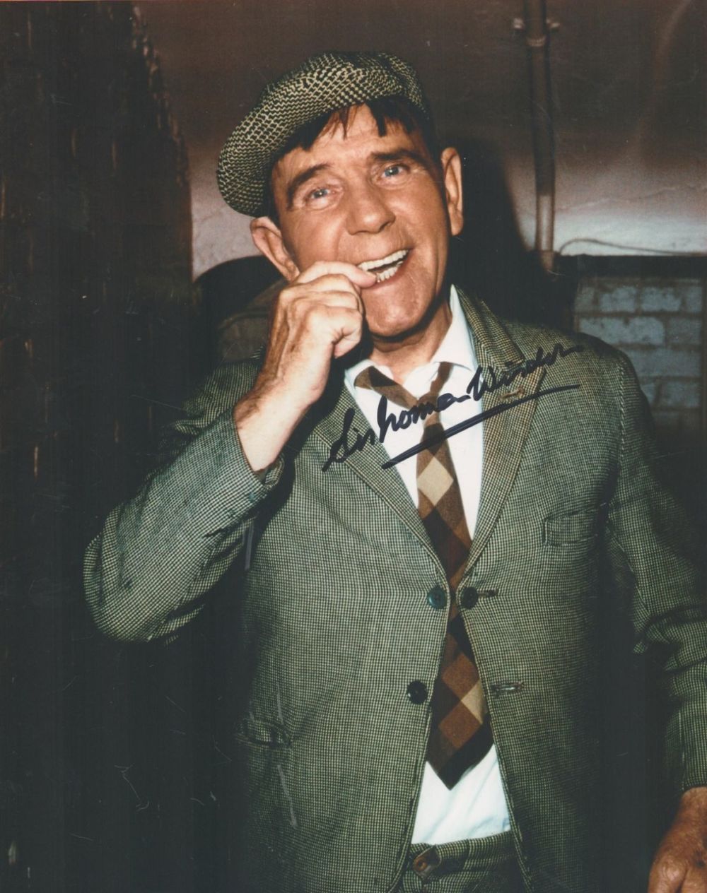 Lot 223: Norman Wisdom signed 10x8 colour photo. Sir Norman...