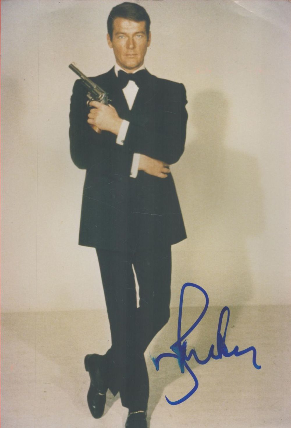 Lot 98: James Bond Roger Moore signed 12 x 8...