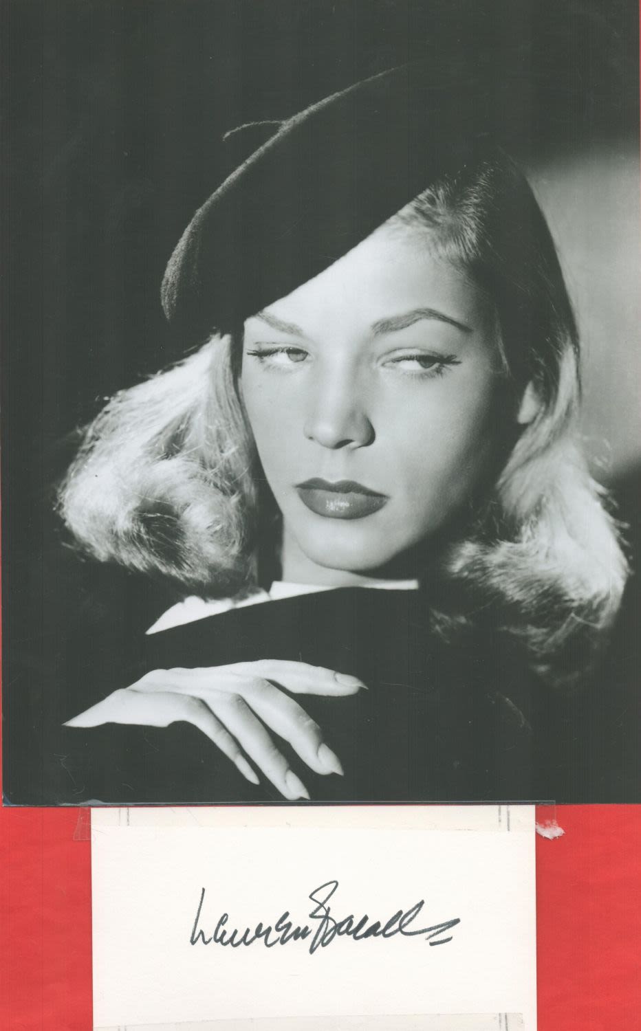 Lot 197: Lauren Bacall signed 6x3 white card affixed to...