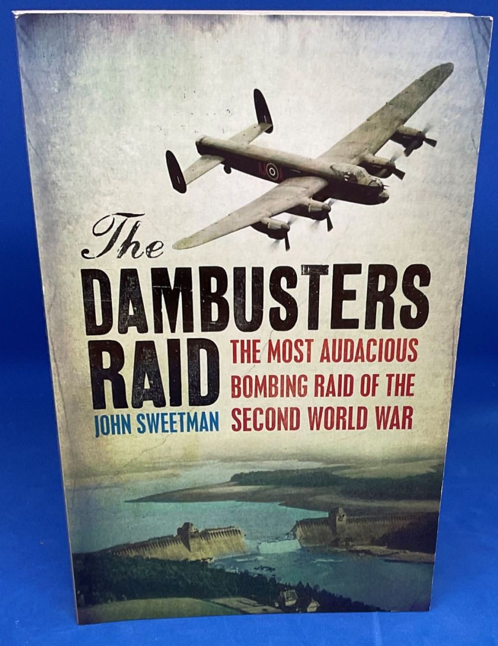 Lot 542: John Sweetman Paperback Book titled The Dambuster Raid-...
