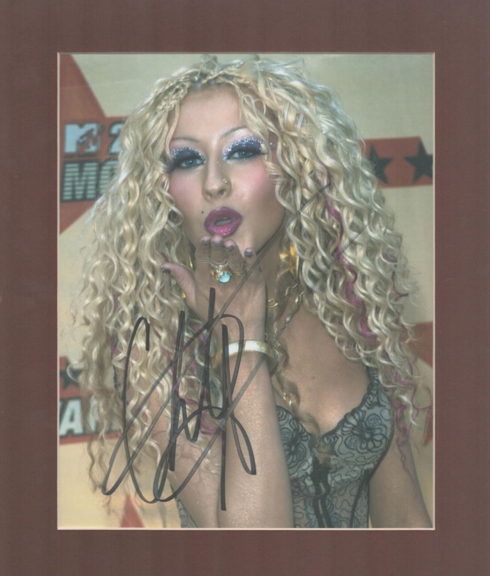 Lot 81: Christina Aguilera signed 10x8 overall mounted colour photo....
