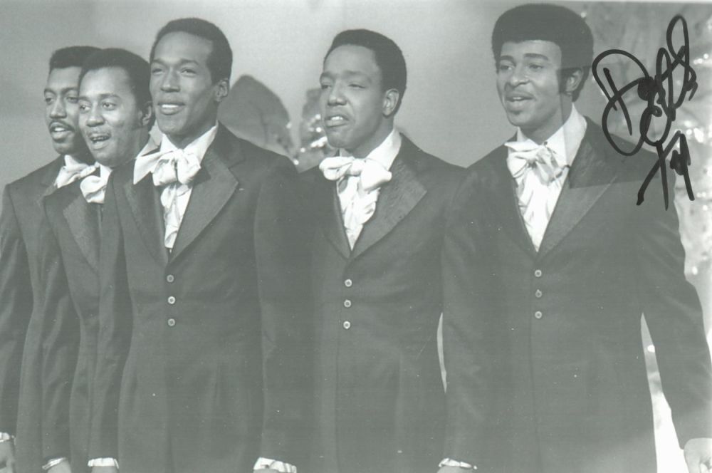Lot 209: The Temptations signed 12x8 black and white photo...