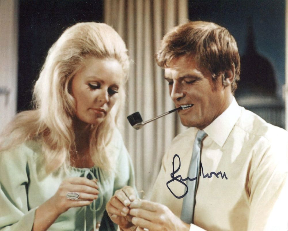 Lot 677: Roger Moore as The Saint signed 8x10 photo....