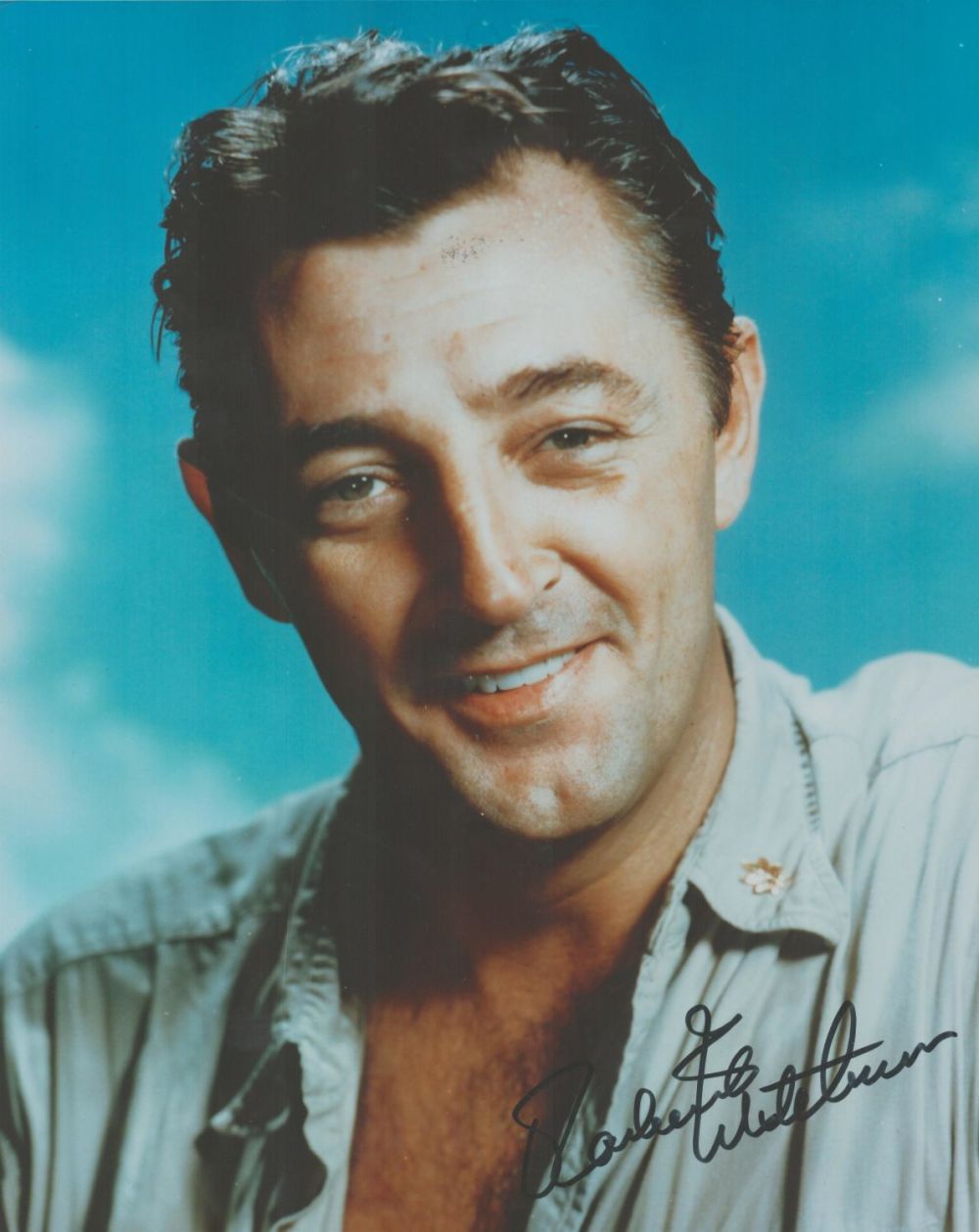 Lot 125: Robert Mitchum signed 10x8 colour photo. Mitchum (August...