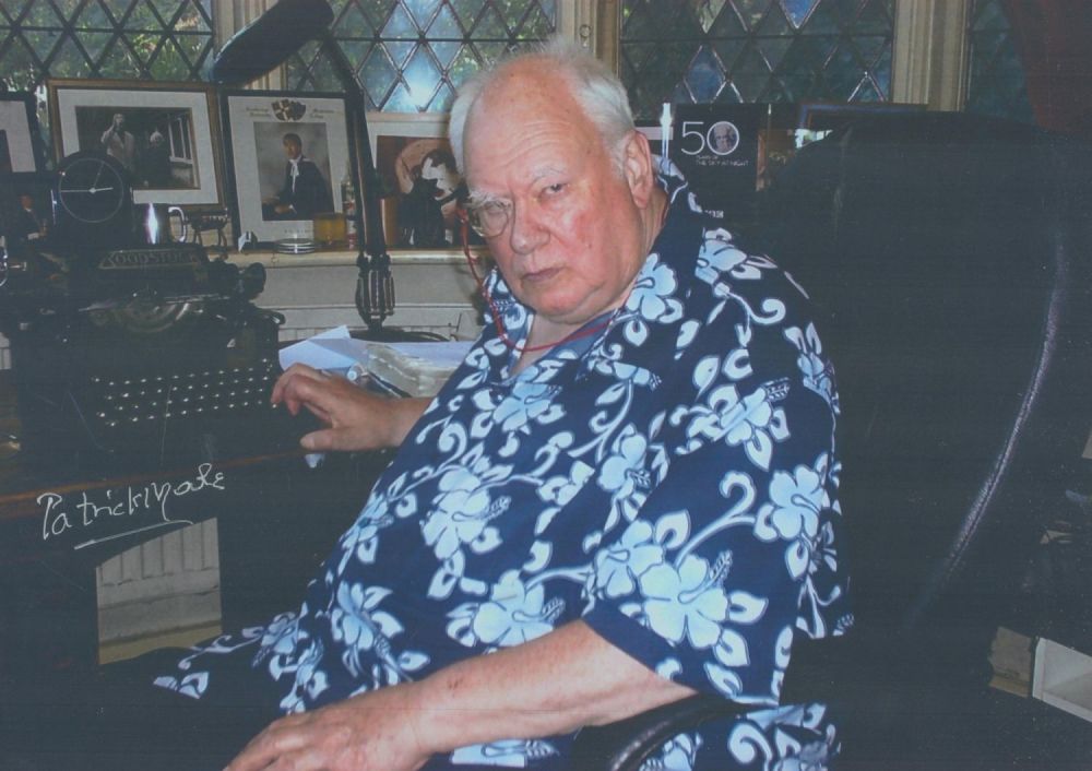 Lot 33: Patrick Moore signed colour photograph of Moore sitting...