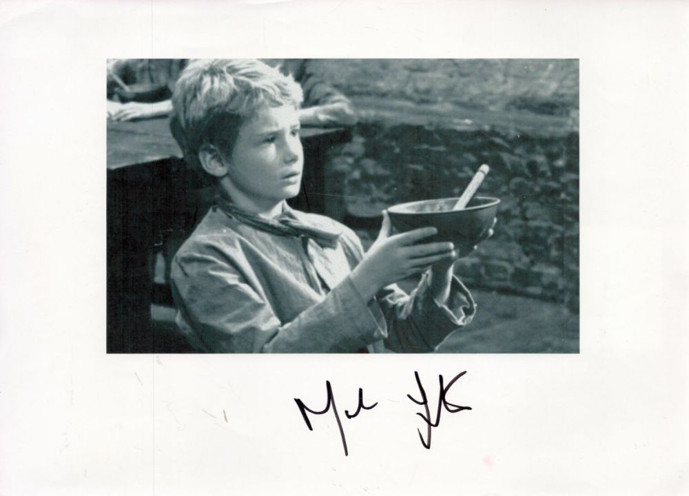 Lot 446: Mark Lester (Oliver Twist) Signed 12x8 inch Black...