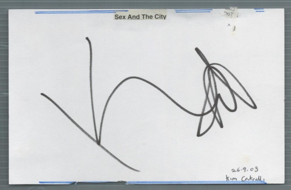 Lot 156: Kim Cattrall signed white card in black marker...