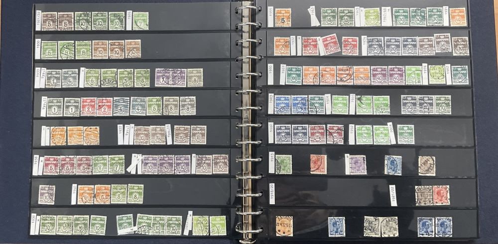 Lot 76: Denmark stamps housed in a binded folder in...