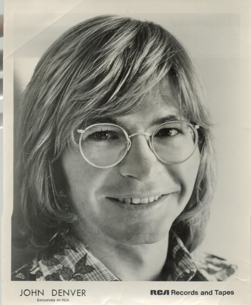 Lot 247: John Denver signed 10x8 black and white photo....