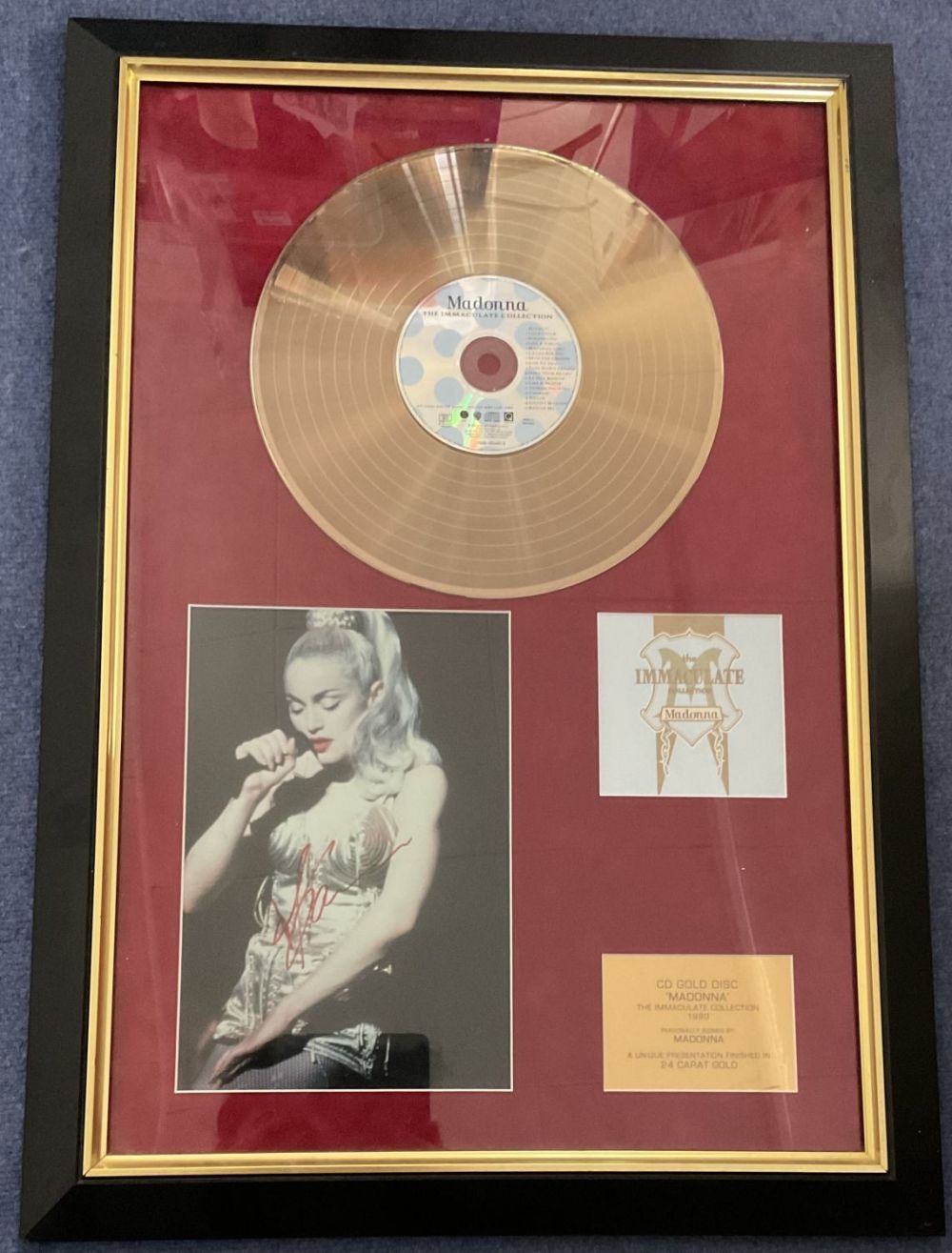 Lot 526: Madonna Signed Colour Photo Set in a Presentation...