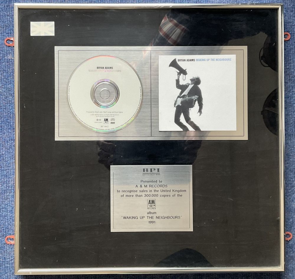Lot 654: Bryan Adams BPI Award Presented to A and...